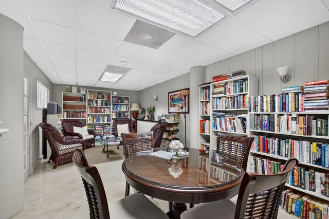 a view of a hallway with wooden floor and closet area