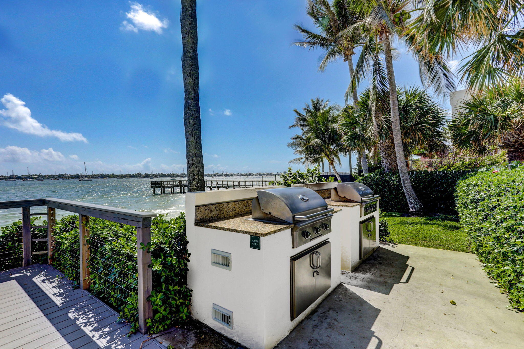 5600 North Flagler Drive, Unit 2703 West Palm Beach, FL 33407 - Photo 43 of 60 a view of a chairs and table in patio