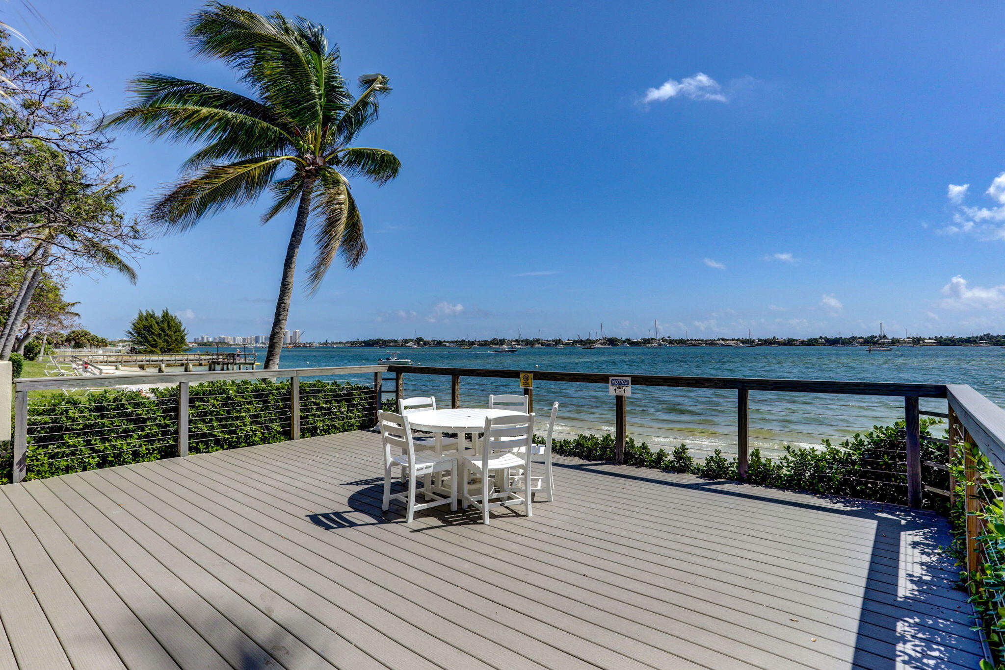 5600 North Flagler Drive, Unit 2703 West Palm Beach, FL 33407 - Photo 44 of 60 a terrace with outdoor seating and city view