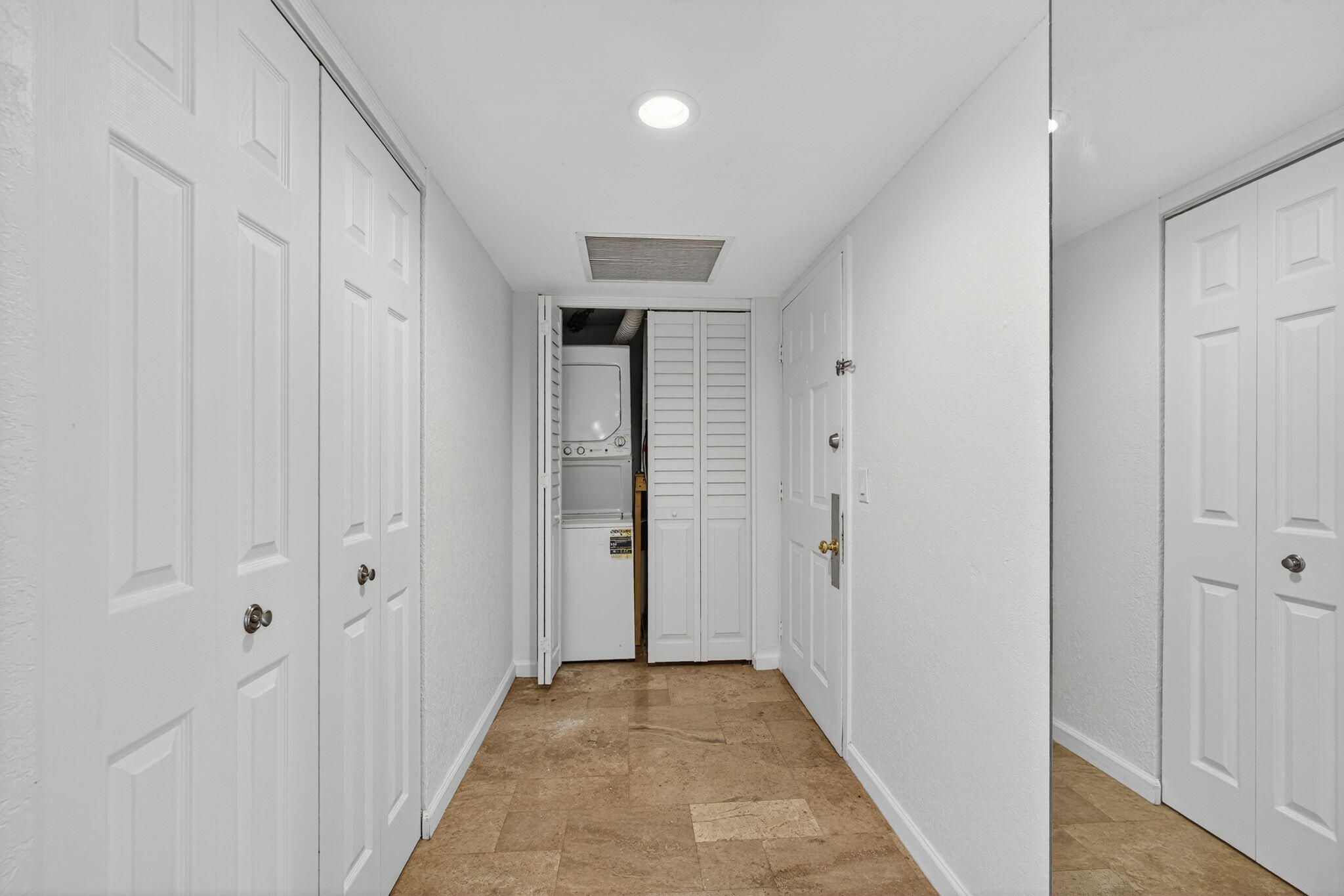 5600 North Flagler Drive, Unit 2703 West Palm Beach, FL 33407 - Photo 45 of 60 a view of a hallway with wooden floor and closet area