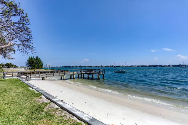 an aerial view of a house with outdoor space and lake view