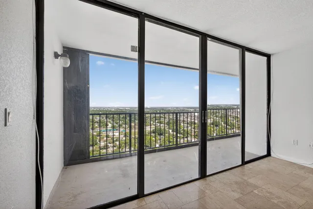 a view of an empty room with windows