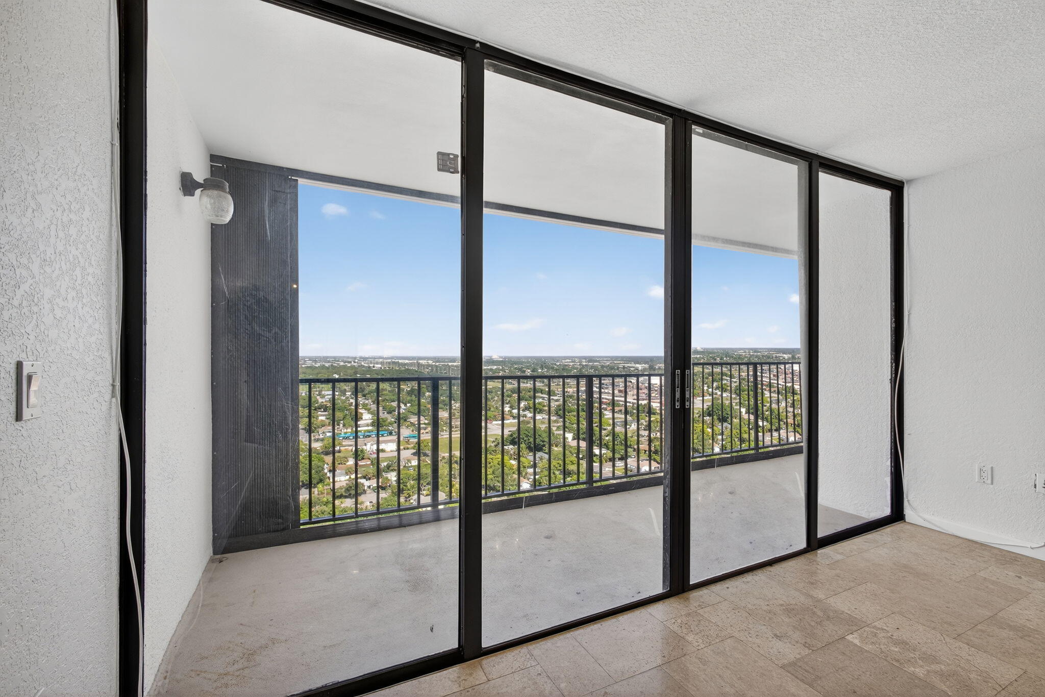 5600 North Flagler Drive, Unit 2703 West Palm Beach, FL 33407 - Photo 7 of 60 a view of an empty room with windows