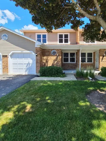 a view of a yard in front of a house