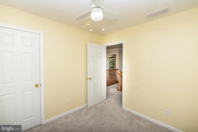 a view of a hallway with a chandelier