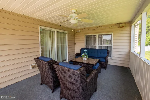 a view of a patio with furniture