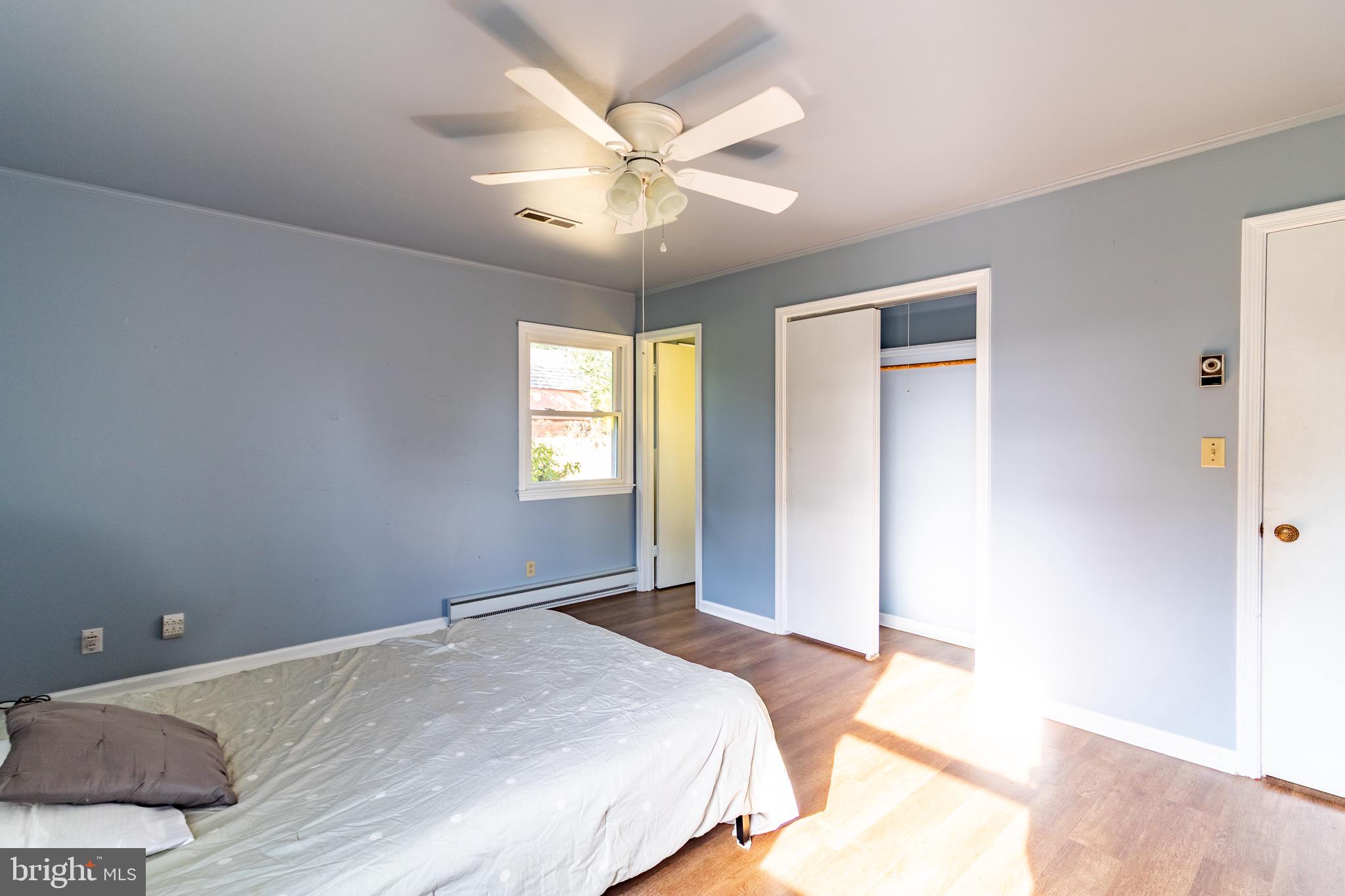 16505 Ridgeway Road Orange, VA 22960 - Photo 14 of 28 a bedroom with a bed and a chandelier