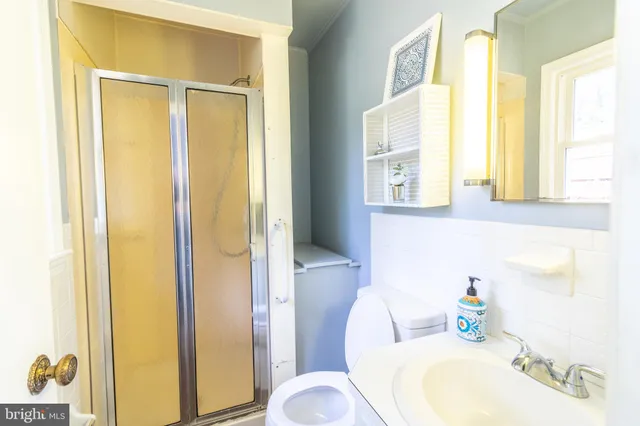 a room that has a sink and a table in it