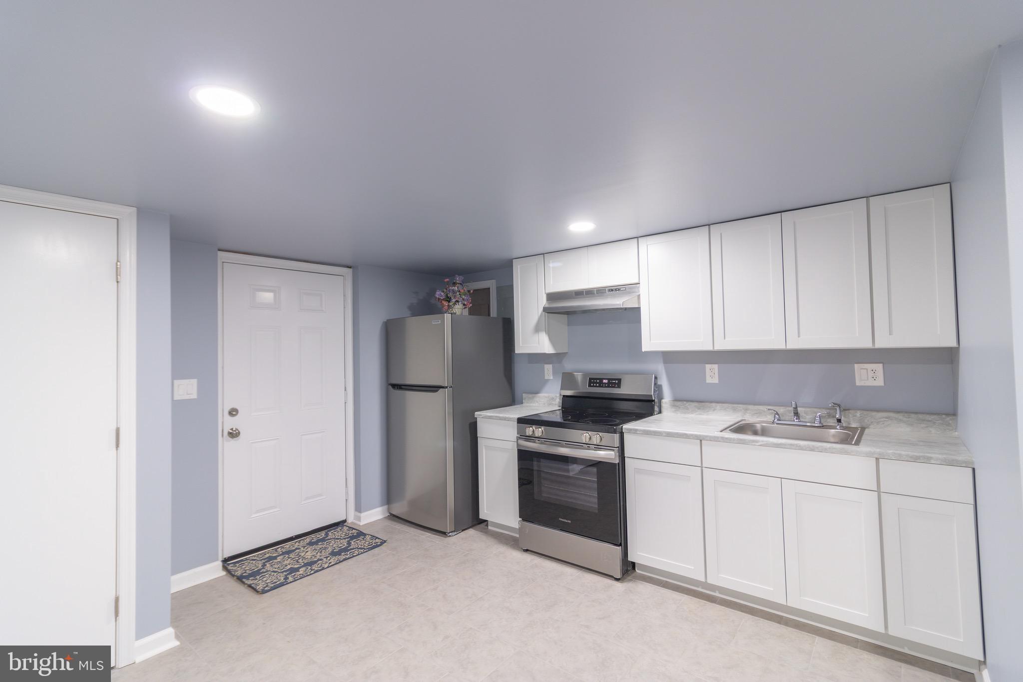 16505 Ridgeway Road Orange, VA 22960 - Photo 2 of 28 a kitchen with a sink stove and refrigerator