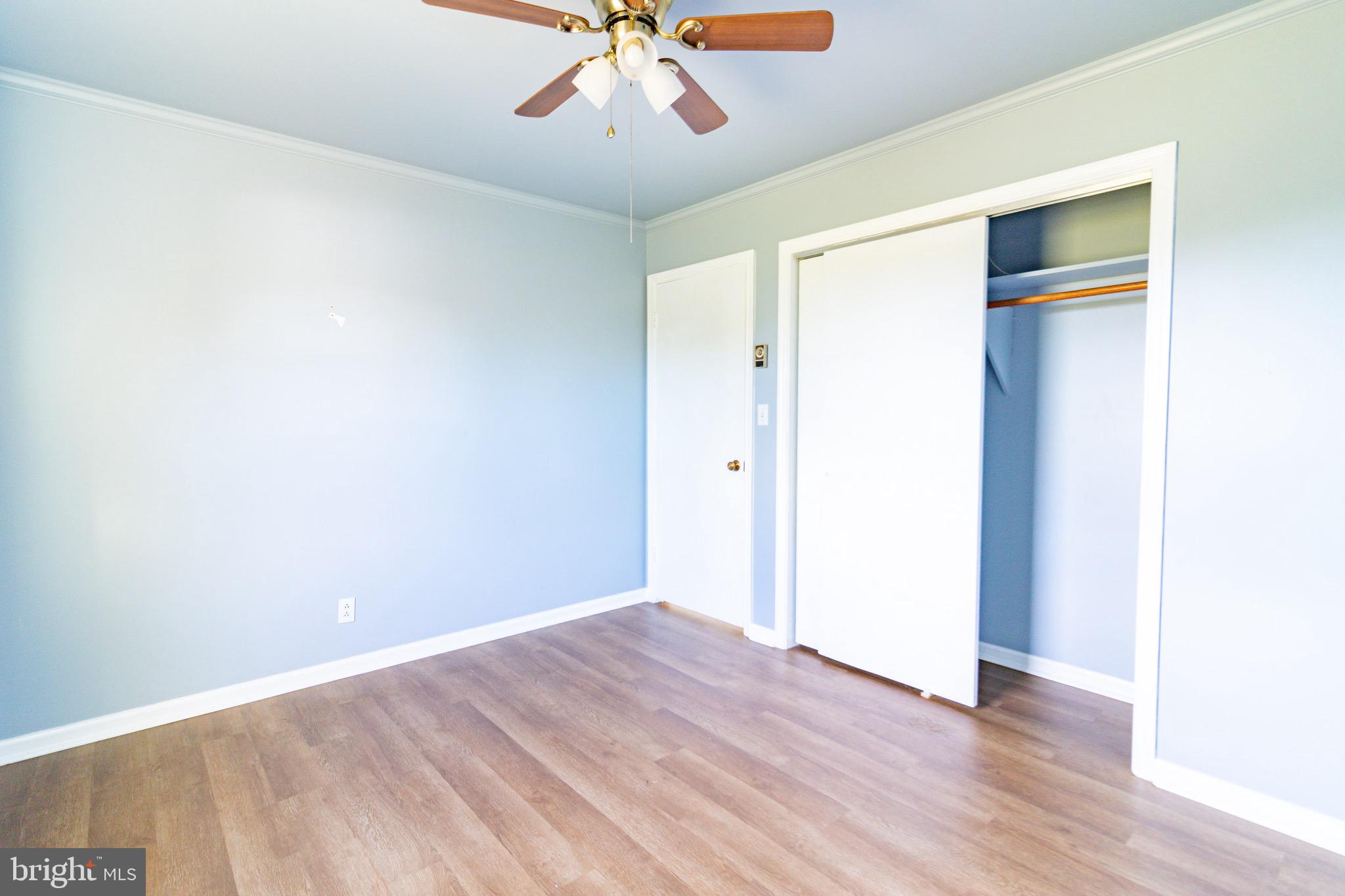 16505 Ridgeway Road Orange, VA 22960 - Photo 21 of 28 a view of an empty room with a chandelier fan