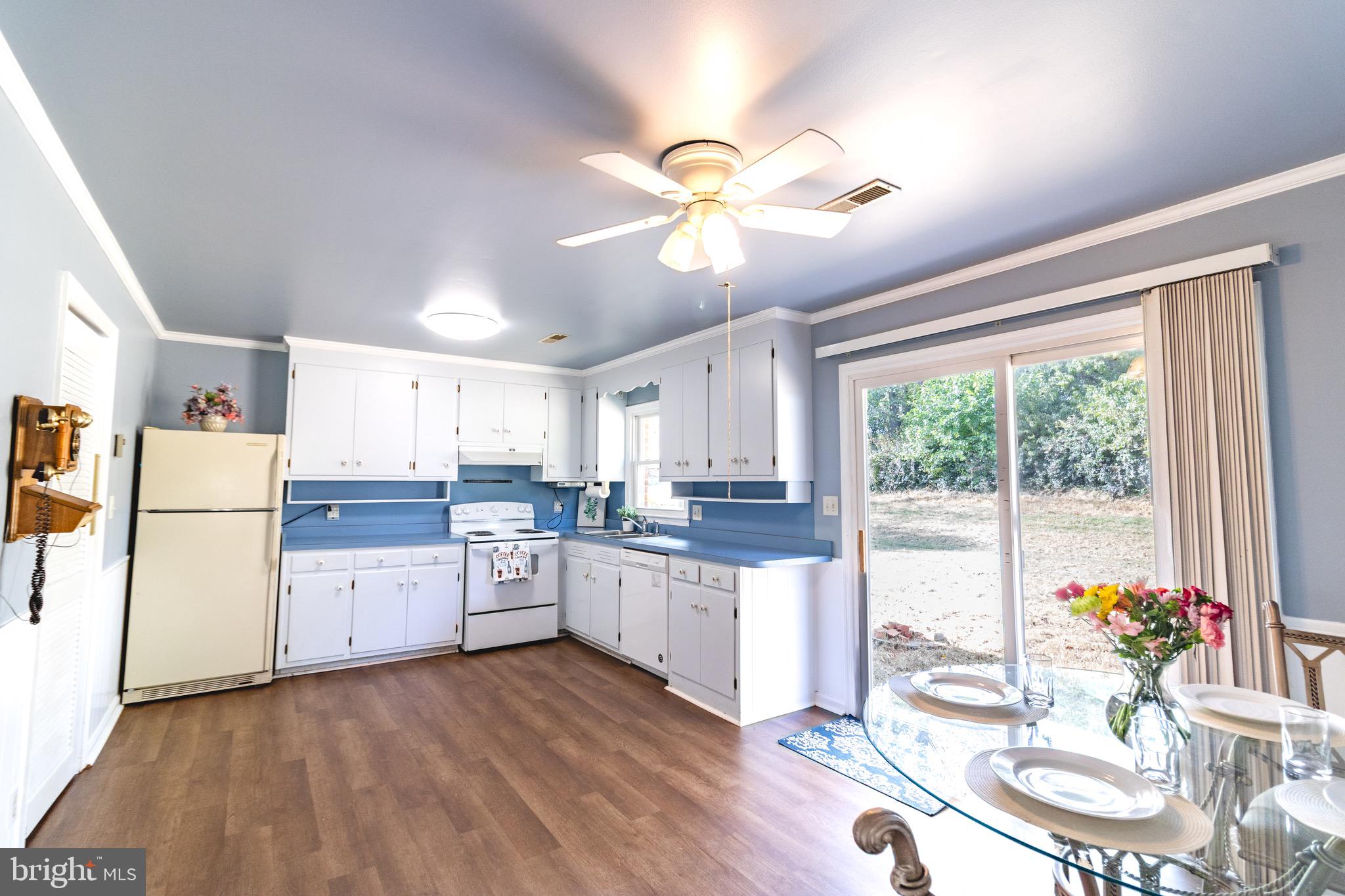 16505 Ridgeway Road Orange, VA 22960 - Photo 5 of 28 a kitchen with a sink appliances cabinets and dining table