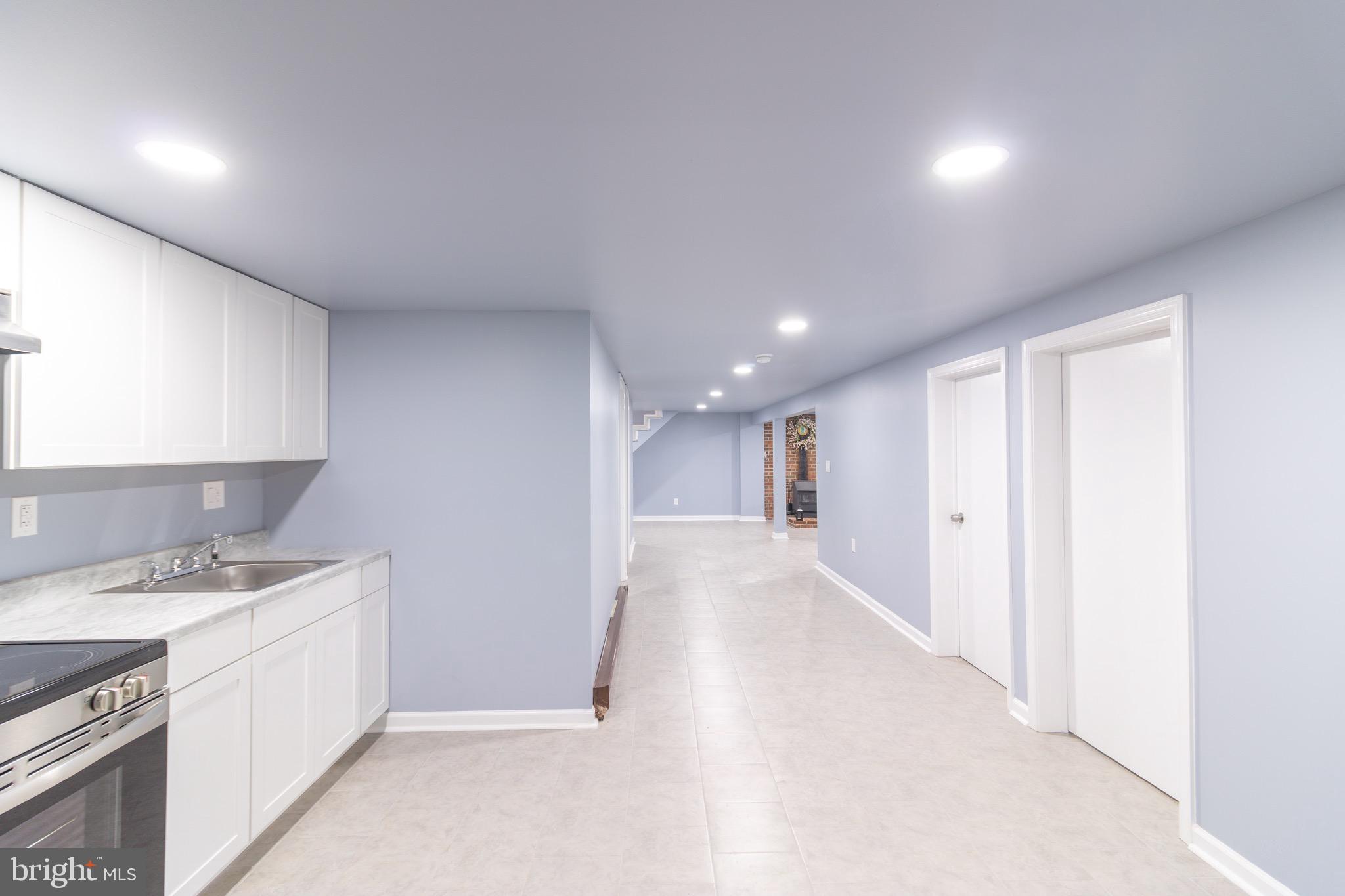 16505 Ridgeway Road Orange, VA 22960 - Photo 7 of 28 a view of a kitchen with a sink and dishwasher a refrigerator with wooden floor