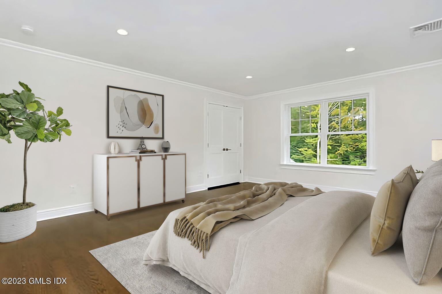 196 Valley Road Cos Cob, CT 06807 - Photo 14 of 18 a bed sitting in a spacious bedroom next to a window
