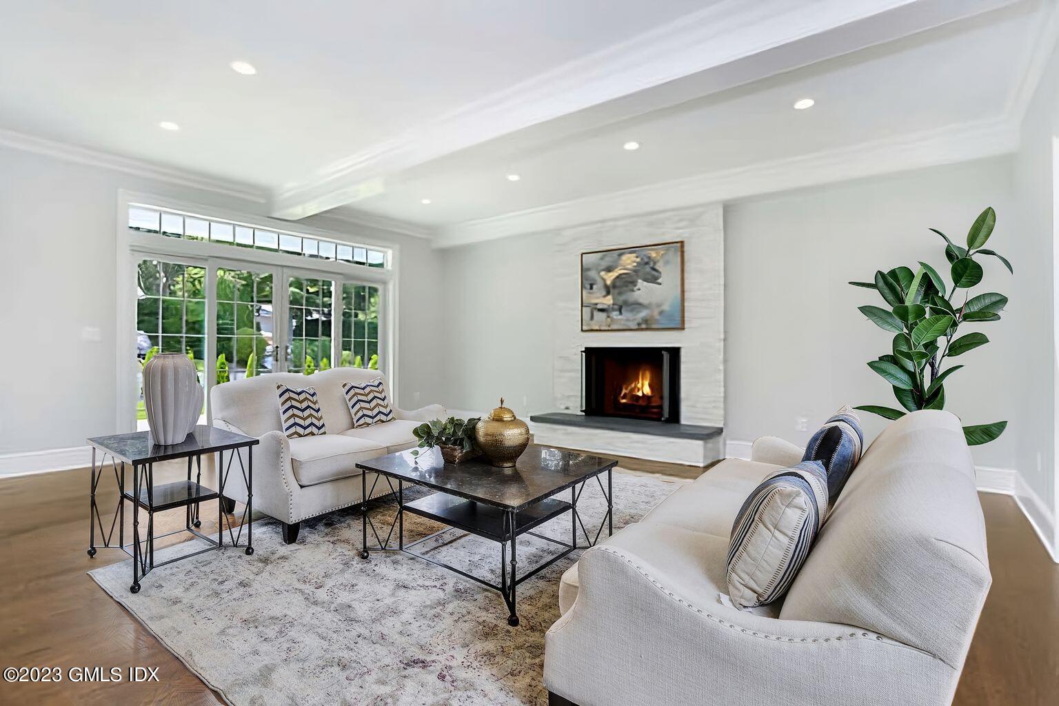 196 Valley Road Cos Cob, CT 06807 - Photo 6 of 18 a living room with furniture lamp and a fireplace