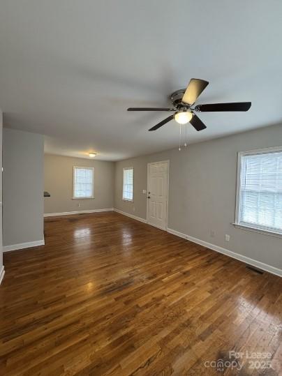 1007 Thomas Street Kannapolis, NC 28081 - Photo 2 of 3 a view of empty room with wooden floor and fan