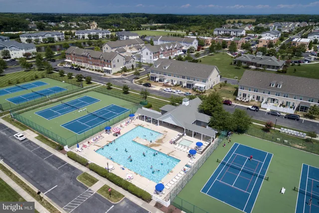 a large building with a clock tower in front of it