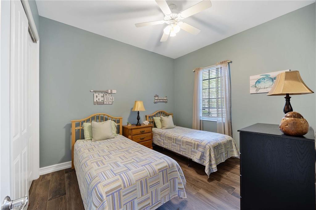 8902 Shenendoah Circle Naples, FL 34113 - Photo 17 of 28 a bedroom with two beds and a lamp
