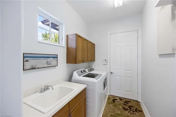 a bathroom with a sink toilet and mirror