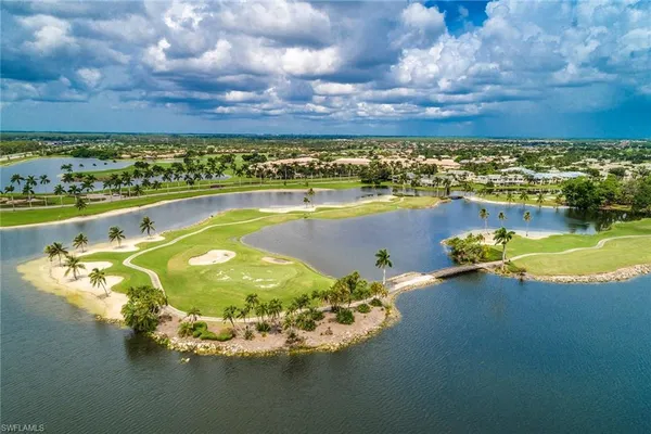 a view of a lake with a house in the background