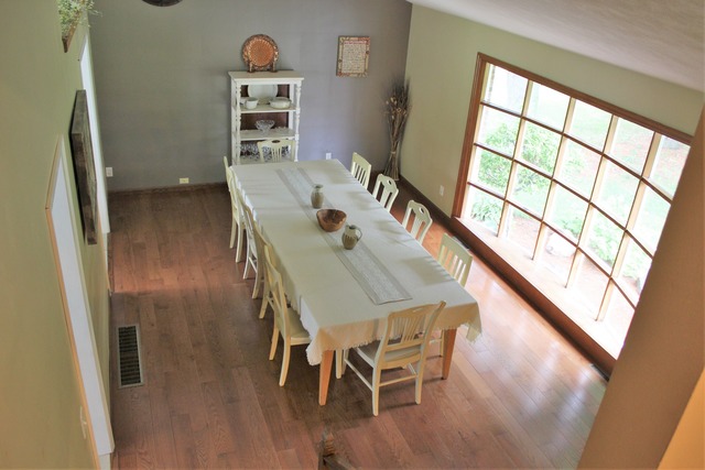 5589 Shattuck Road Belvidere, IL 61008 - Photo 6 of 20 a view of a dining room with furniture wooden floor and window