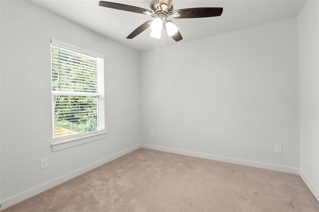 312 East Shepherd Street, Unit 312 Denison, TX 75021 - Photo 8 of 15 an empty room with a window and a fan