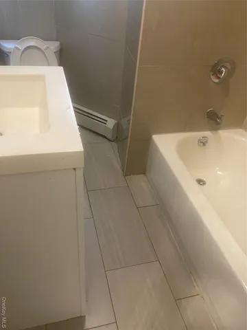 a bathroom with a toilet and sink