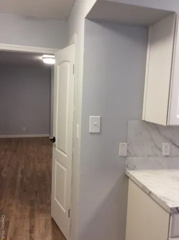 a view of a storage & utility room with a sink