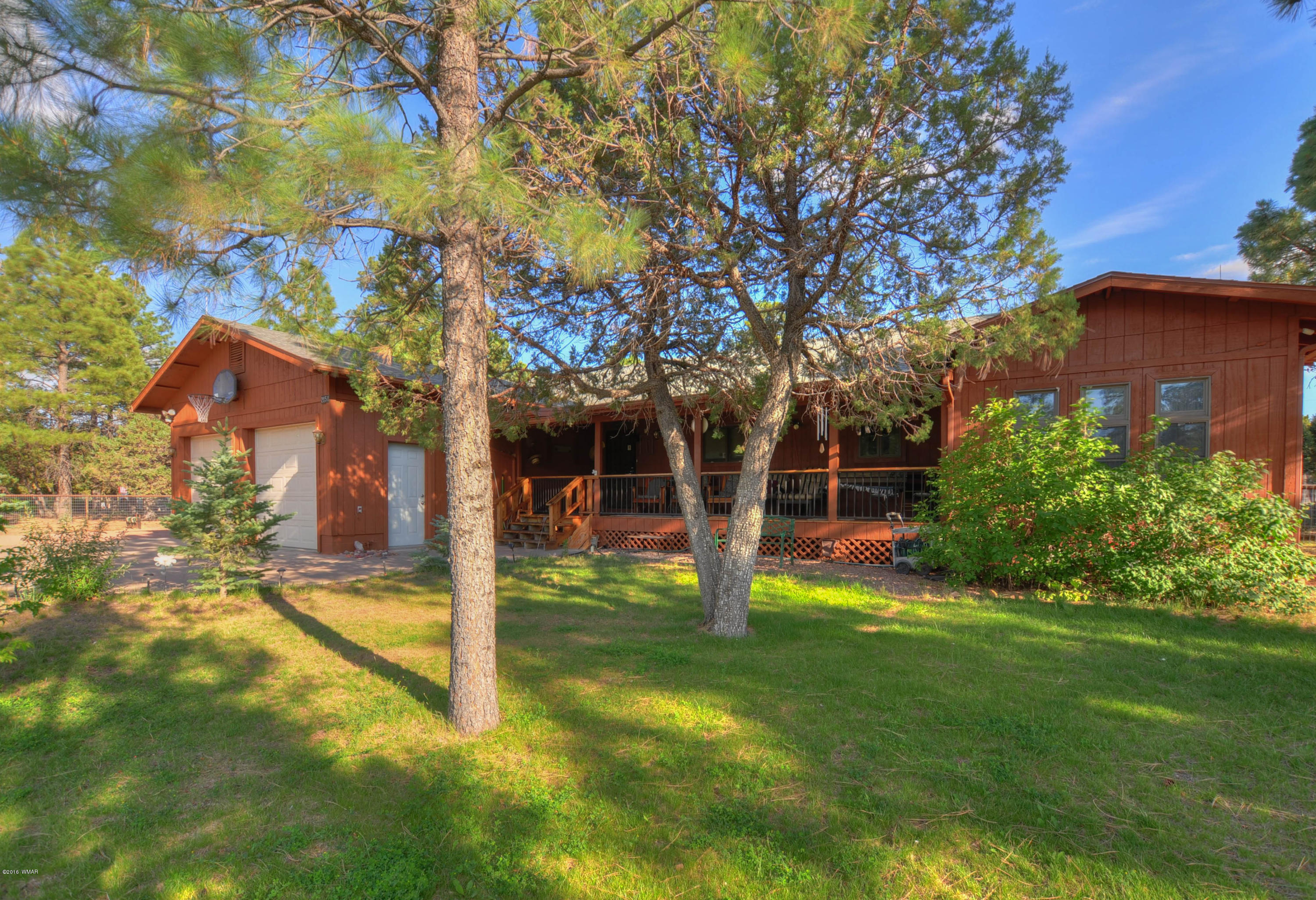 2151 Chevelon Road Overgaard, AZ 85933 - Photo 1 of 27 a view of a house with a backyard