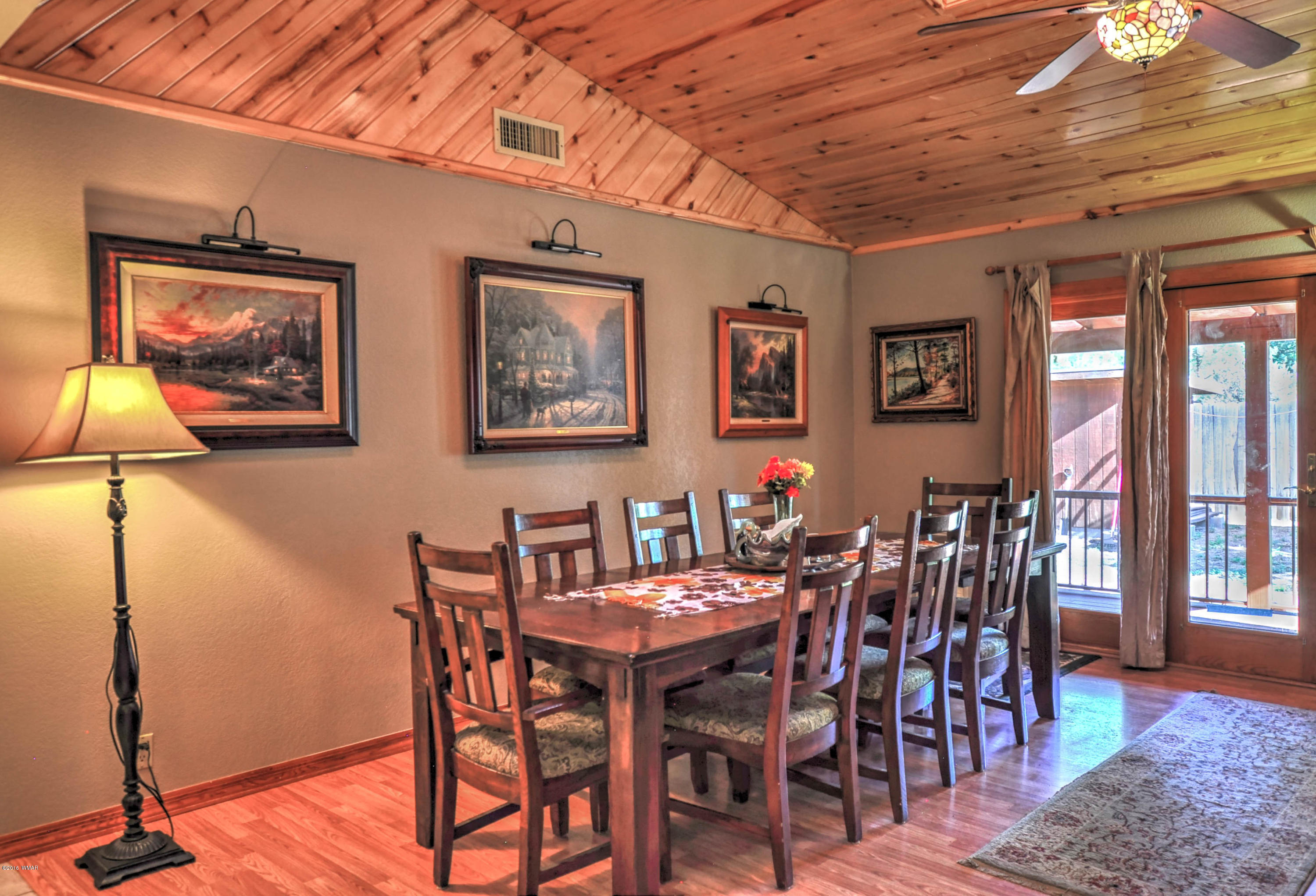 2151 Chevelon Road Overgaard, AZ 85933 - Photo 11 of 27 a view of a dining room with furniture and wooden floor