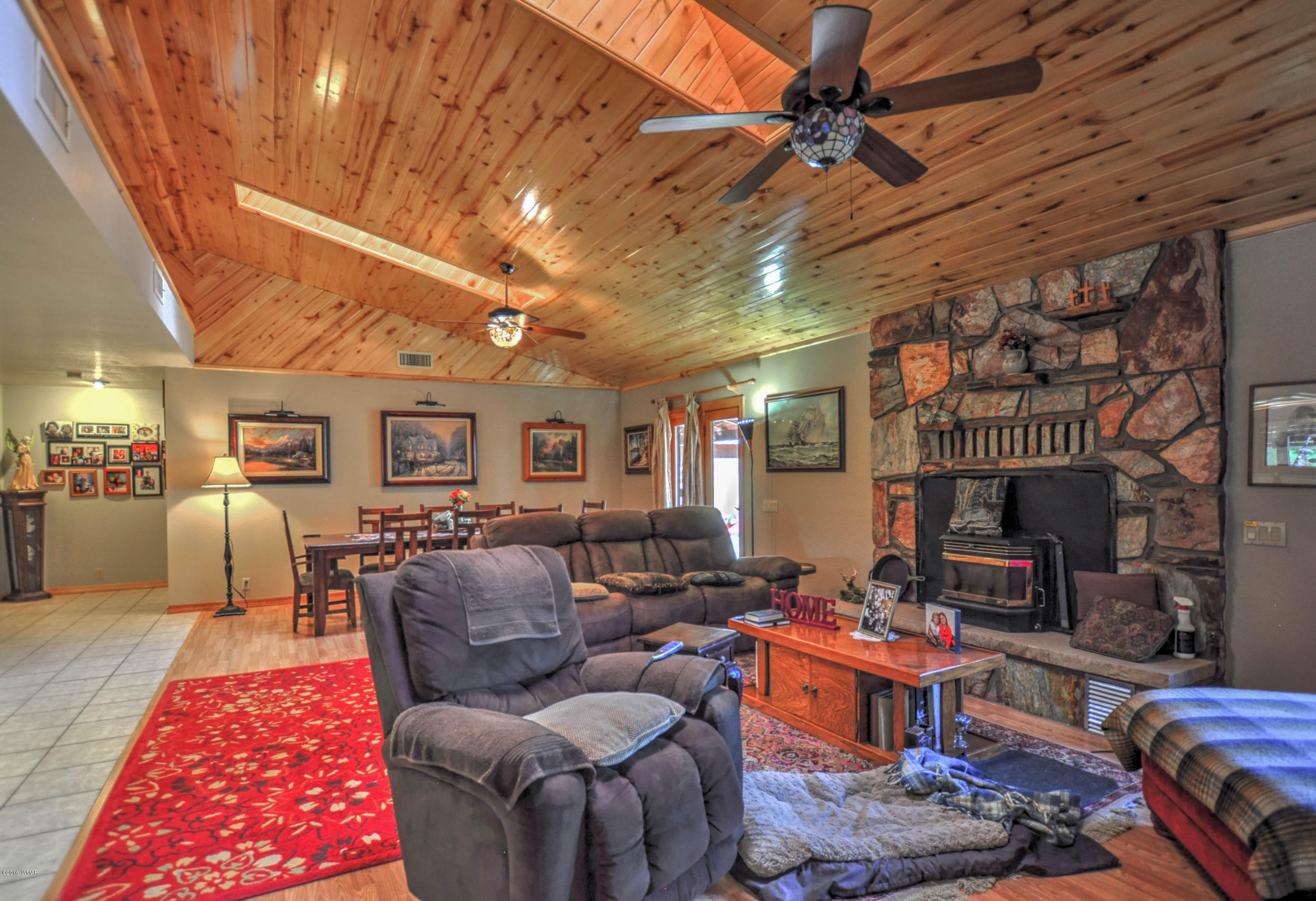 2151 Chevelon Road Overgaard, AZ 85933 - Photo 7 of 27 a living room with furniture and a fireplace