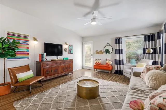 a bedroom with furniture and a flat screen tv