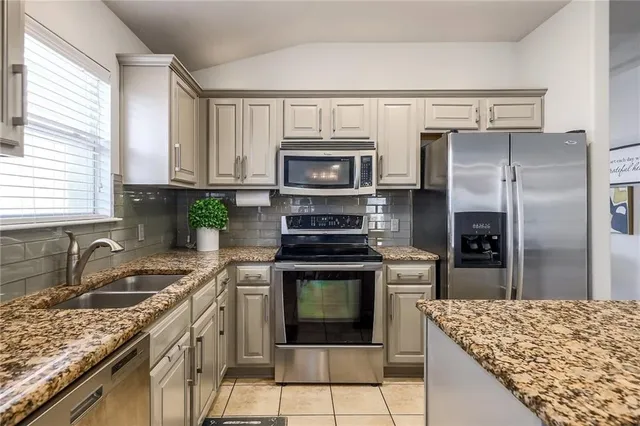 a kitchen with a stove microwave and refrigerator