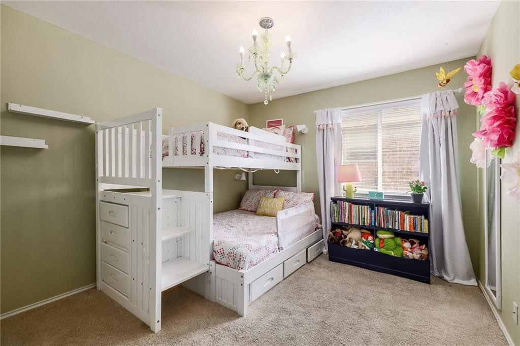 1908 Golden Arrow Avenue Cedar Park, TX 78613 - Photo 20 of 31 a bedroom with a bed and a window