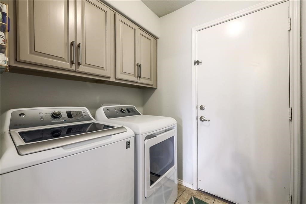 1908 Golden Arrow Avenue Cedar Park, TX 78613 - Photo 22 of 31 a utility room with dryer and washer