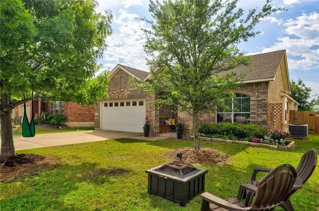 a view of a patio with couches chairs and swimming pool with a yard