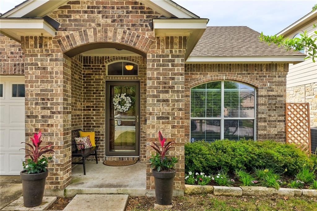 1908 Golden Arrow Avenue Cedar Park, TX 78613 - Photo 5 of 31 a front view of a house with large windows