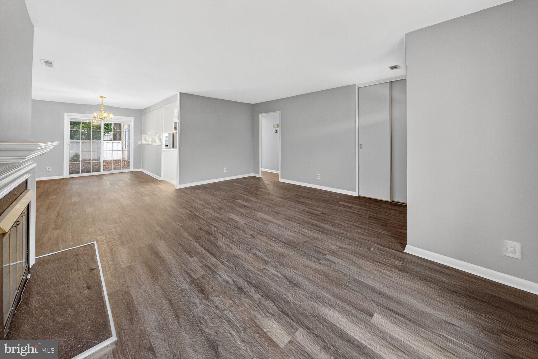 14603 Edelmar Drive, Unit 132A Silver Spring, MD 20906 - Photo 20 of 60 a view of an empty room with wooden floor and a window