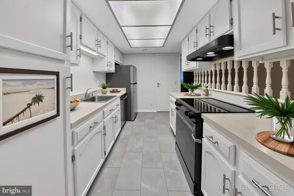 a kitchen with a sink and stove