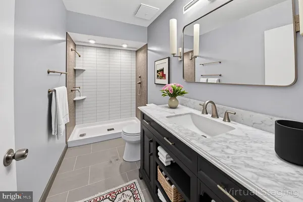 a kitchen with stainless steel appliances sink stove microwave and cabinets