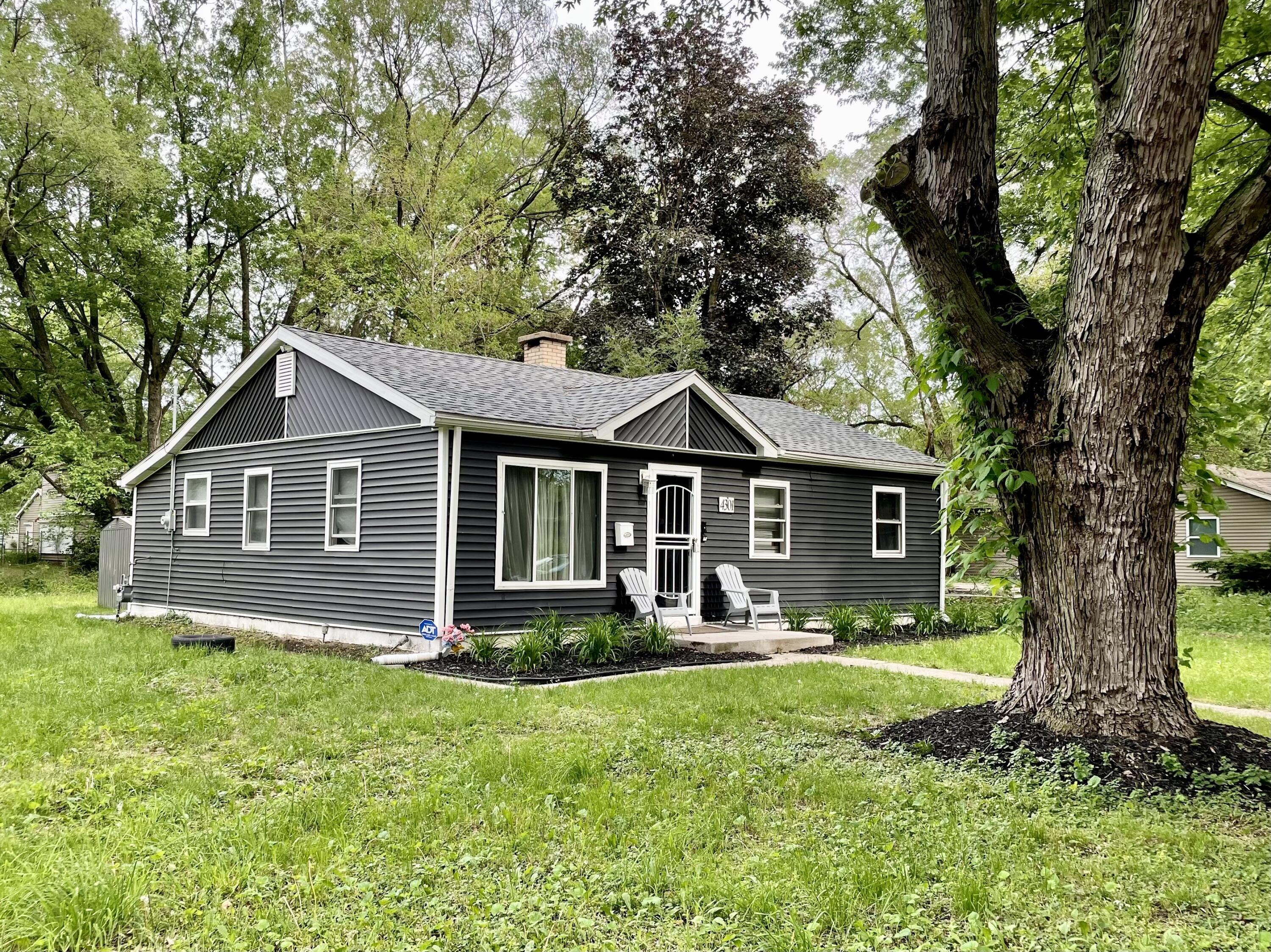 4301 Johnson Street Gary, IN 46408 - Photo 1 of 16 a front view of a house with garden