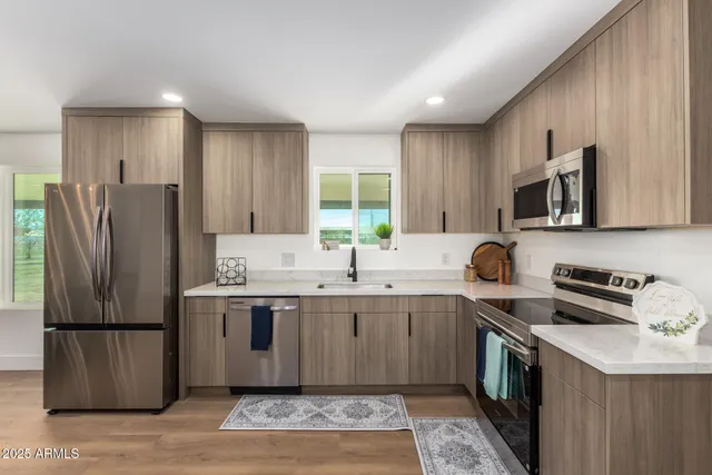 a kitchen with lots of counter top space and dining table