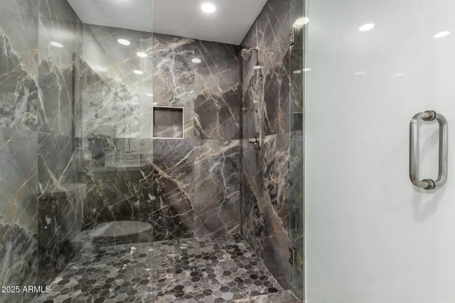 an empty room with a empty space and a ceiling fan