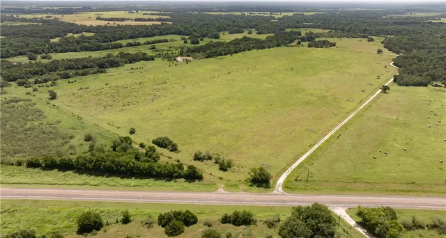 an aerial view of beach and residential space