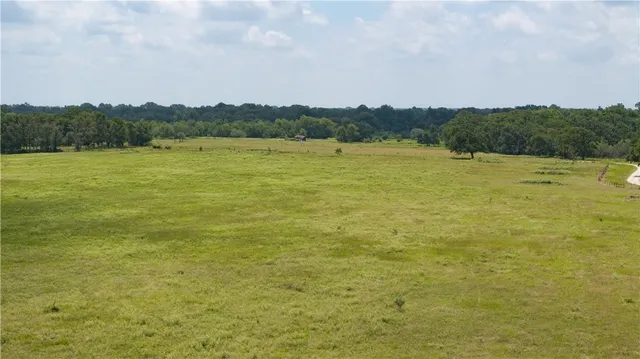 a view of a lake with a yard