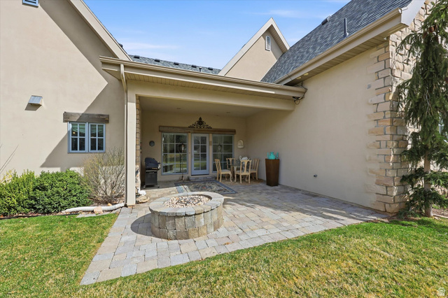 930 Price Farm Court Midway, UT 84049 - Photo 36 of 42 View of back patio, with concrete pavers and fire pit