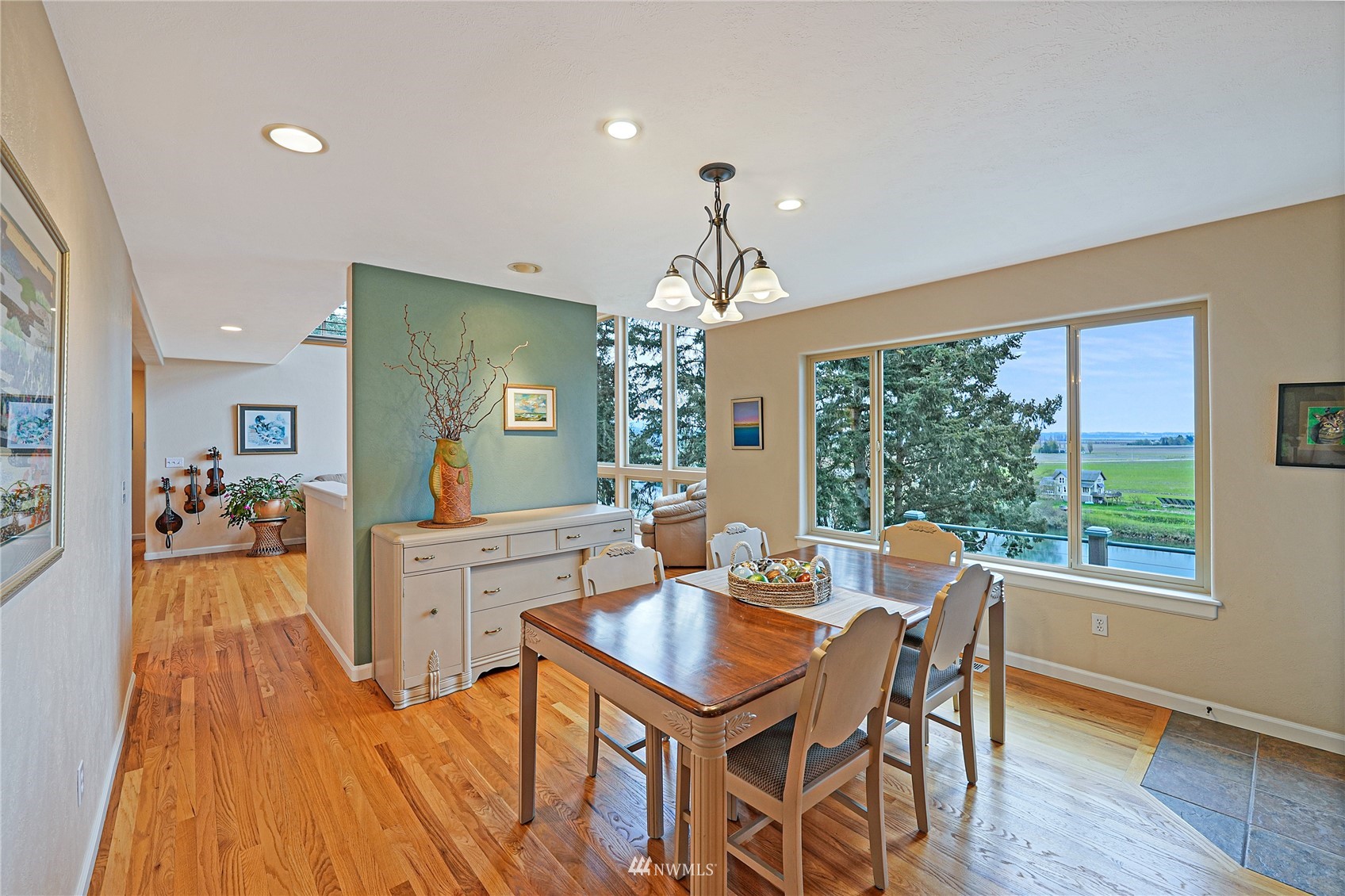 19695 Landing Road Mount Vernon, WA 98273 - Photo 12 of 40 a view of a dining room with furniture window and wooden floor
