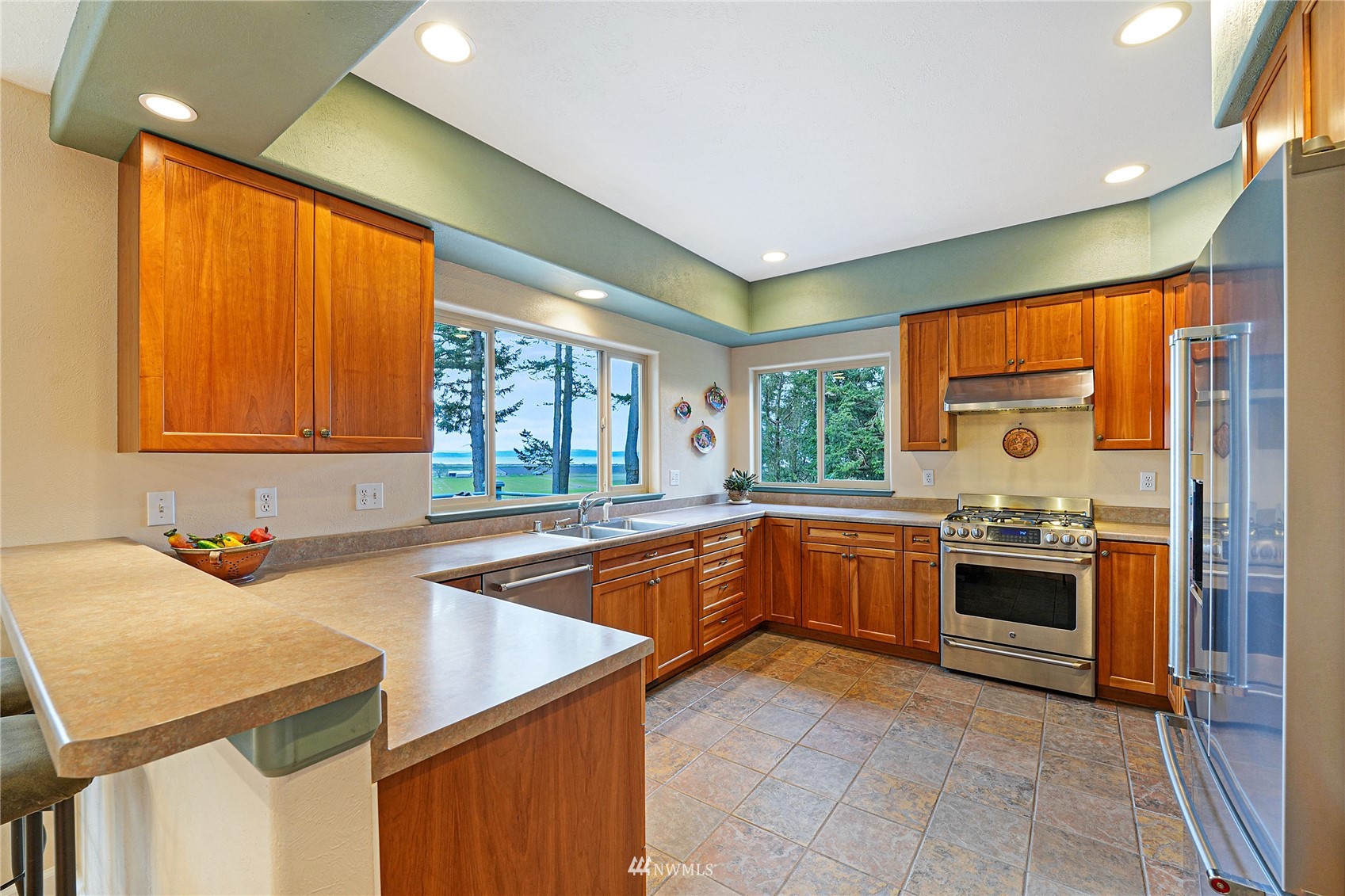 19695 Landing Road Mount Vernon, WA 98273 - Photo 13 of 40 a kitchen with stainless steel appliances granite countertop a sink and stove