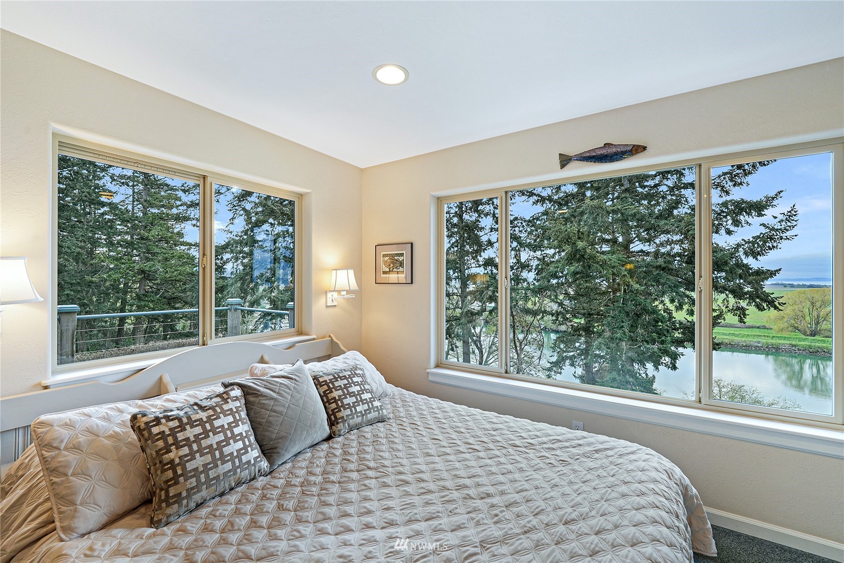 19695 Landing Road Mount Vernon, WA 98273 - Photo 15 of 40 a large bedroom with a bed and a large window