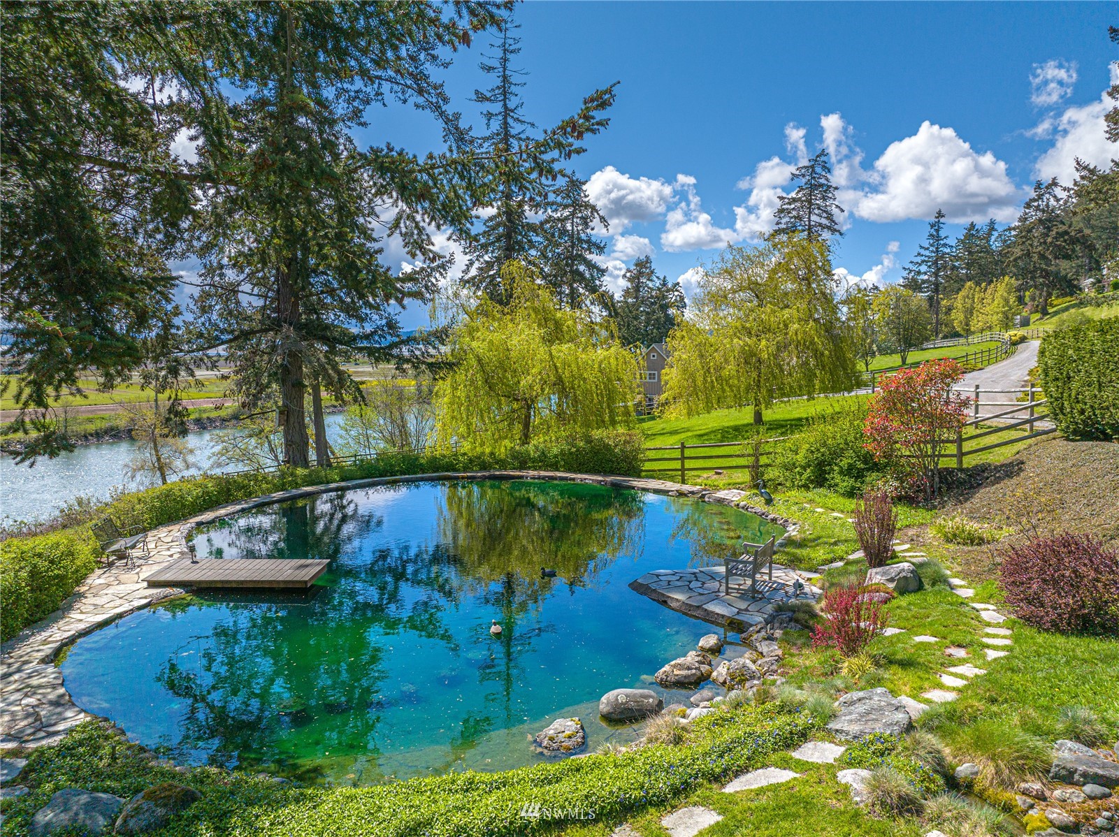 19695 Landing Road Mount Vernon, WA 98273 - Photo 33 of 40 a view of a lake with a yard