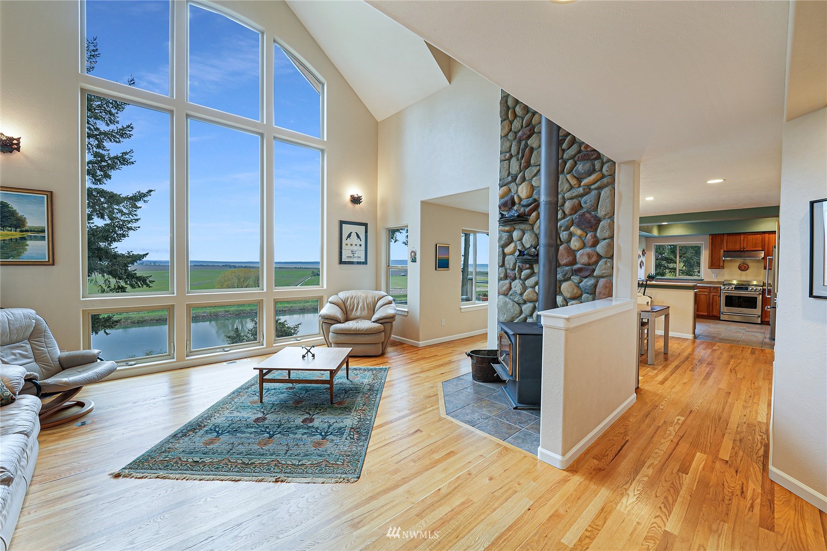 19695 Landing Road Mount Vernon, WA 98273 - Photo 8 of 40 a living room with furniture large window and wooden floor